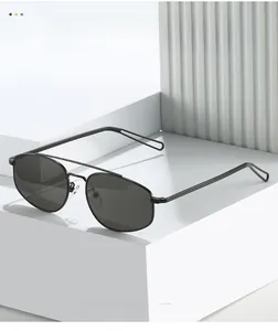 Detail view of black metal hexagonal sunglasses with double bridge and cut-out temple tips