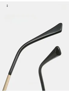 Detail of TR90 cat-eye glasses showing curved temples and gold metal hinges for comfort