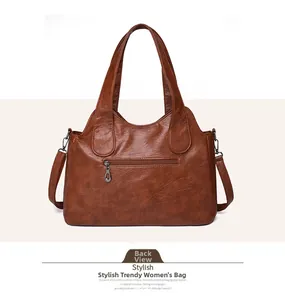 Detailed rear view of brown large soft leather tote bag with functional zipper pocket