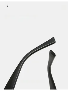 Detailed macro view of black ergonomic curved mirror legs on stylish cat eye sunglasses