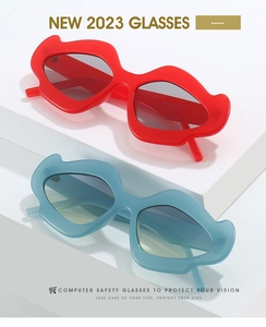 Detail of stylish mustache and lip shaped sunglasses in vibrant red and soft blue