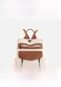 Front view of beige vintage backpack with brown leather trim and multi-pocket details