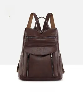 Detailed front view of brown faux leather backpack with vintage lychee texture