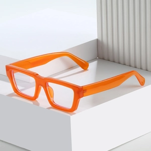 Modern thick square orange glasses frames with anti-blue light lenses on a geometric base