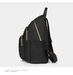 Side view of black nylon backpack with multi-layer gold zippers and adjustable straps