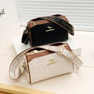 Quilted leather camera bag with wide textile strap and gold kangaroo logo in two colors