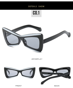 Detailed views of geometric butterfly sunglasses with contrast black and white frames
