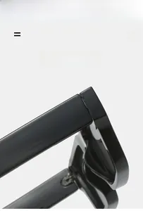 Detailed close-up of flexible metal hinge on black glossy rectangle frame sunglasses
