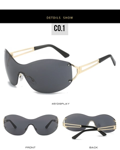 Detail view of Y2K rimless oversized sunglasses with grey lens and hollow gold metal temples