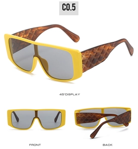 Detailed views of oversized square sunglasses with yellow frames and tortoiseshell temples
