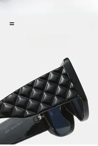Detailed macro view of black sunglasses temple featuring a 3D quilted texture and CE markings
