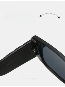 Detail view of the durable metal hinge and CE mark on black square sunglasses frame