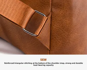 Detail of reinforced triangular stitching on leather backpack strap for durability