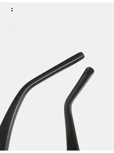 Macro detail of ergonomic curved temple legs on black glossy hip-hop sunglasses