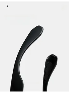 Close-up of curved black sunglasses temples with anti-slip texture and high-gloss finish