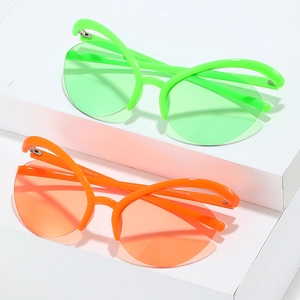 Modern Y2K cat-eye sunglasses in fluorescent green and bright orange with wrap frames