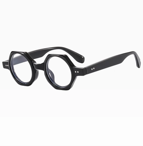 Detail of asymmetric frame sunglasses with one round and one hexagonal black lens rim