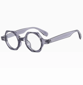 Side view of translucent grey-purple hexagonal eyeglass frames with metal rivet detail