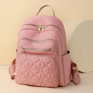 Pink quilted nylon backpack for women with star stitching and gold hardware
