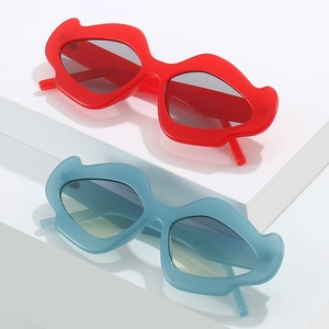 Creative mustache-shaped sunglasses in red and blue colors on a geometric platform
