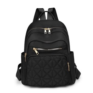 Black nylon quilted backpack for women with gold zippers and large capacity compartments