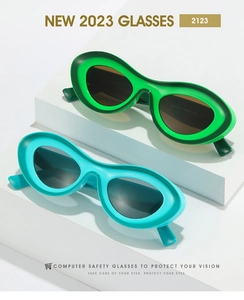 Close-up of retro wave-shaped sunglasses frames in bright green and teal colors