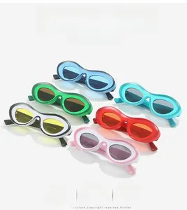 Top view of oval sunglasses collection in vibrant colors like green, red, and blue