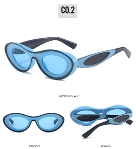 Detail view of oval contrast frame sunglasses with blue lenses and sleek two-tone finish