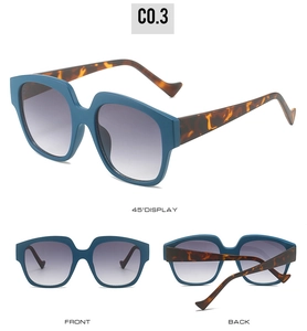 Detailed views showing matte blue frames and tortoise temples of oversized sunglasses