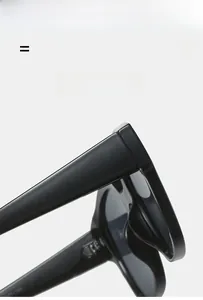 Close-up of flexible hinges and high-quality glossy texture on black sunglasses frames
