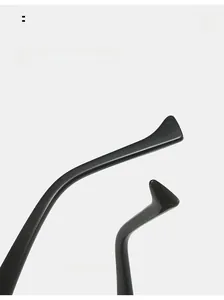 Macro shot of glossy black curved sunglasses temples with a sleek minimalist design