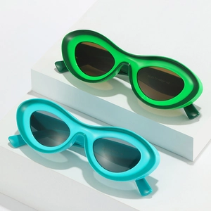 Trendy thick frame oval sunglasses in green and blue colors for a stylish modern look