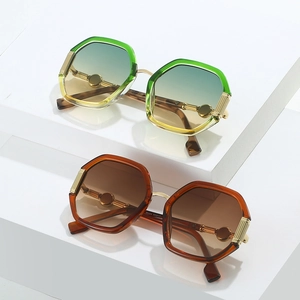Geometric polygonal sunglasses with gradient lenses and elegant gold metal temple accents