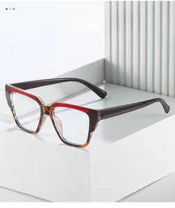Close-up of square TR90 cat-eye frame in dark red and tortoise shell contrast colors