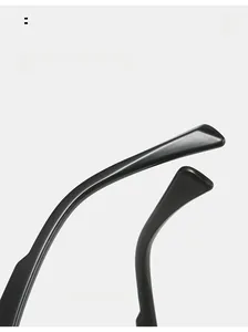 Macro detail of ergonomic curved mirror legs on stylish black sunglasses frame