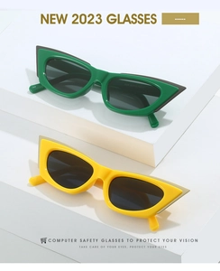 Detail view of colorful cat eye sunglasses featuring modern geometric two-tone frames