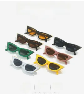 Flat lay of seven stylish cat eye sunglasses in various colors with metallic frames