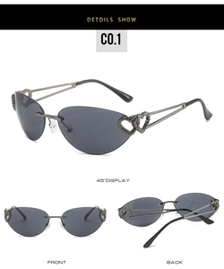 Detailed macro view of rimless cat-eye sunglasses with gunmetal heart-shaped metal temples