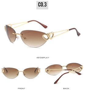 Detail view showing gold metal frame with hollow heart decoration and brown gradient lenses