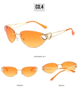 Detail of orange gradient heart sunglasses with golden cutout double heart hinges