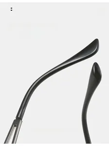 Macro detail of curved mirror legs on frameless heart sunglasses with silver metal joints