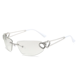 Lunettes de soleil sans monture avec branches en métal argenté et design cœur Y2K