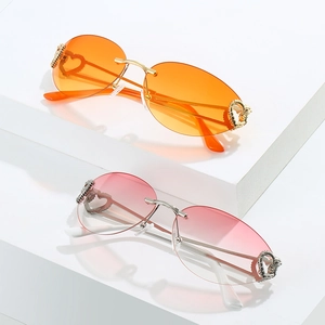 Frameless heart-shaped sunglasses with metal hollow design on white geometric blocks