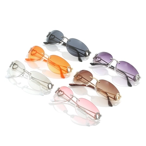 Collection of heart-shaped rimless sunglasses in six colors with metal frames on white background