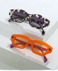 Detail of retro oversized geometric sunglasses with tortoiseshell and orange frames