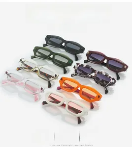 Detailed overhead view of multiple chunky rectangle sunglasses in diverse vibrant colors