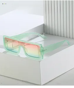 Detail of light green transparent frame and orange-blue gradient sunset sunglasses lens