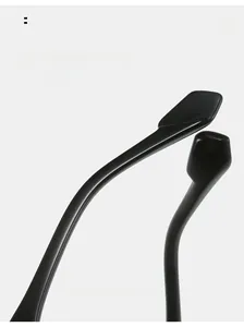 Close-up of ergonomic curved sunglasses temples in glossy black resin finish
