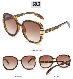 Detailed views of tortoise shell oval sunglasses with gradient lenses and gold metal trim