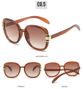 Three-view display of vintage oval sunglasses with amber frames and gold temple accents